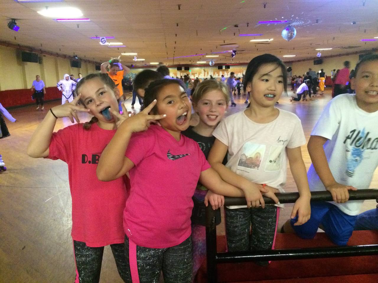 Claire and Shyanne at the roller rink with friends